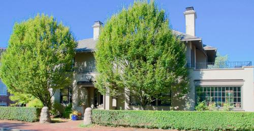 a house with two trees in front of it at Hilltop Inn in Newport