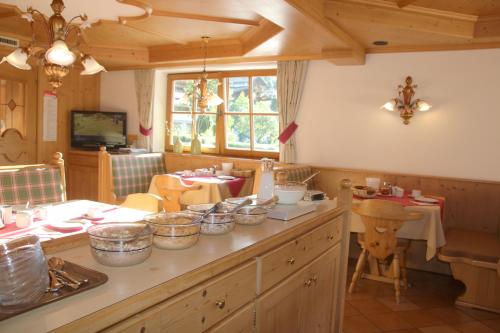 a kitchen with a counter with bowls on it at Pension Sonnhof in Brixen im Thale