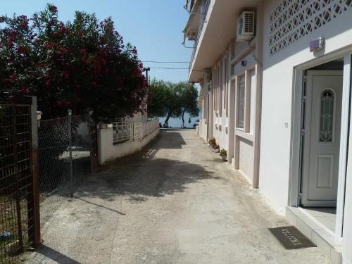 an alley with a white building and a door at The Twins in Glífa
