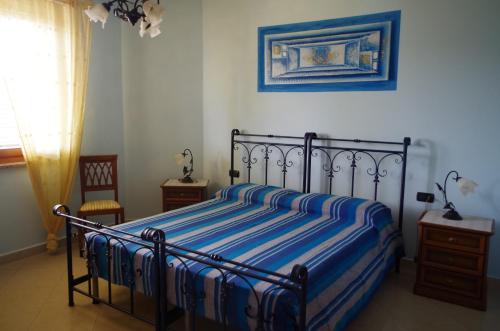 Postel nebo postele na pokoji v ubytování B&B La Pineta