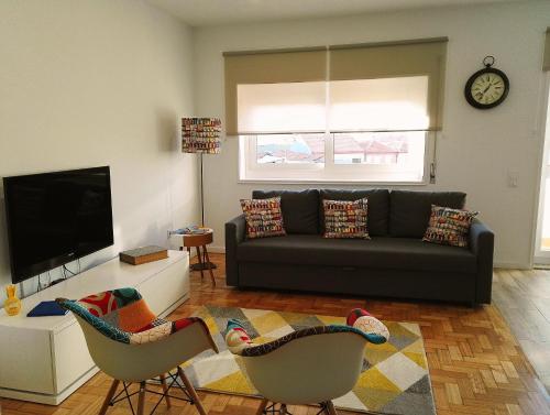 a living room with a couch and two chairs at Always Porto in Vila Nova de Gaia