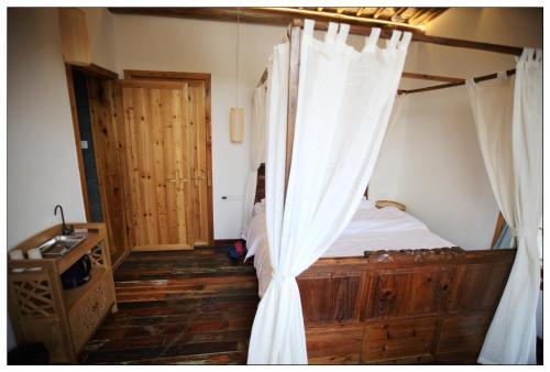 Postel nebo postele na pokoji v ubytování Begonia Flowers Guesthouse