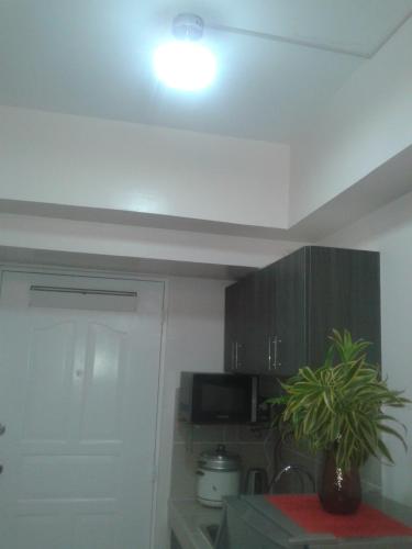 Kuchyň nebo kuchyňský kout v ubytování Migs Place at Tagaytay Prime