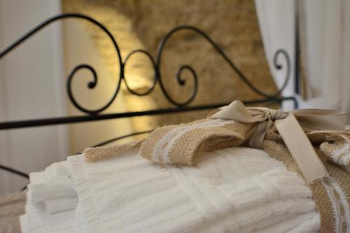 a white dress is sitting on a rack at B&B Fontana La Stella in Gravina in Puglia