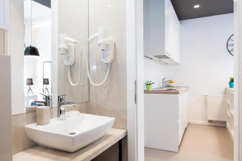 Vonios kambarys apgyvendinimo įstaigoje LOOX serviced apartments Hatzova