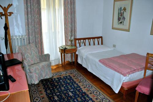 Postel nebo postele na pokoji v ubytování Hotel De La Poste