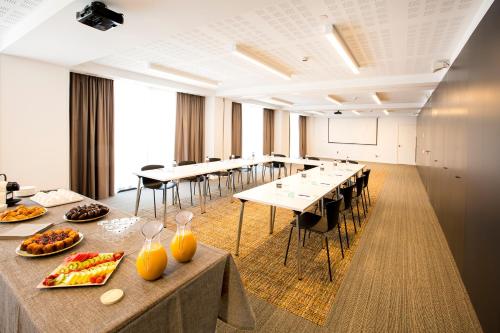 a conference room with tables and chairs in a room at Bordoy Cosmopolitan in Playa de Palma