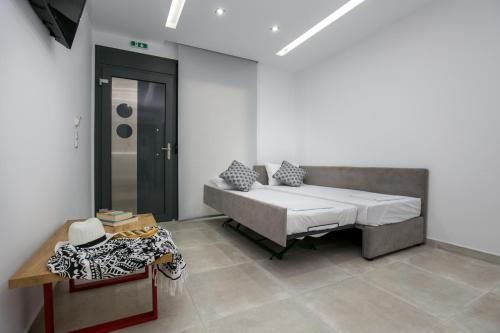 Кровать или кровати в номере Il Grigio Apartments