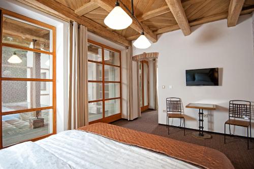 Un pat sau paturi într-o cameră la Vila Lednice
