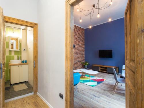 a living room with a table and a dining room at Maniu Home in Cluj-Napoca