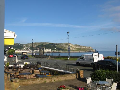 a view of a parking lot next to the ocean at Fairhaven Hotel in Llandudno