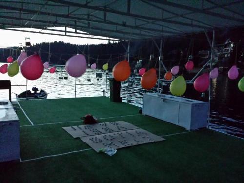 a tent with balloons and a table with a sign on it at Pensiunea Vis Alpin Belis in Beliş