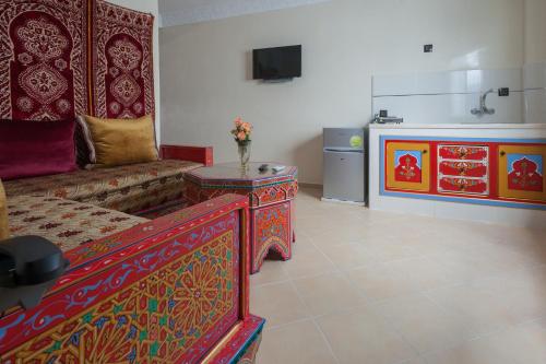 a living room with a couch and a table at Puerta Azul in Chefchaouene