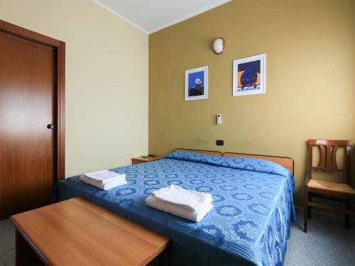 Säng eller sängar i ett rum på Locanda La Castellana