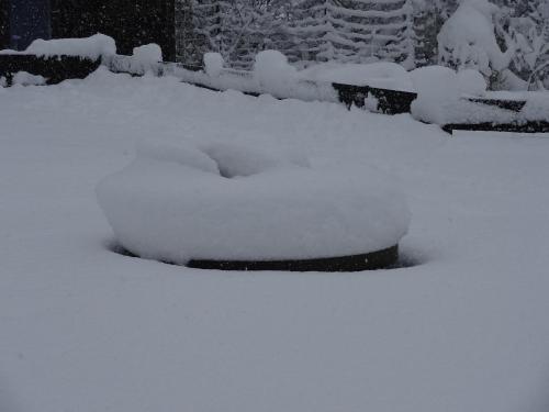 a snow covered planter is covered in snow at La Fermette Blanche in Nadrin