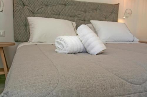 Ένα ή περισσότερα κρεβάτια σε δωμάτιο στο Nida Mykonos