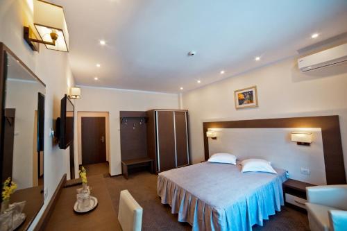Postel nebo postele na pokoji v ubytování Hotel Evergreen
