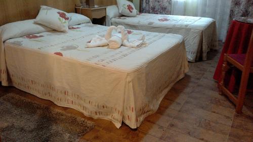 Ένα ή περισσότερα κρεβάτια σε δωμάτιο στο Hostal Ponte Dos Santos