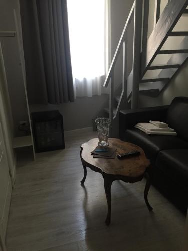 a living room with a couch and a coffee table at Navona Residenza de Charme in Rome
