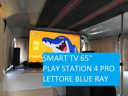 a sign on a bus with the smart pro play station pro lecture at Bed In Bus in Belluno