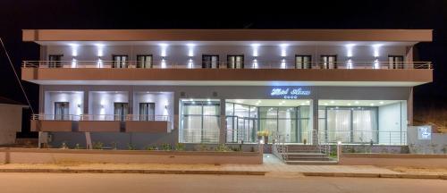 a large building with a lit up sign on it at Hotel Anna in Ioannina