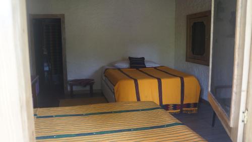 Postel nebo postele na pokoji v ubytování Pine Ridge Lodge