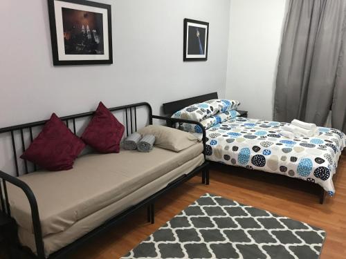 Кровать или кровати в номере MayTower Serviced Apartment
