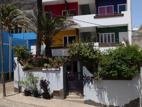 a white building with plants in front of it at kasa Tambla in Ponta do Sol