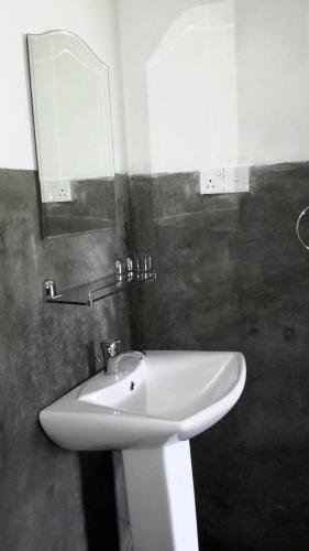 Koupelna v ubytování Raveena Guest House
