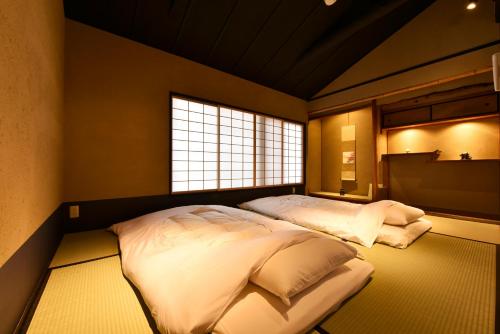 Llit o llits en una habitació de Kuraya Nanseicho