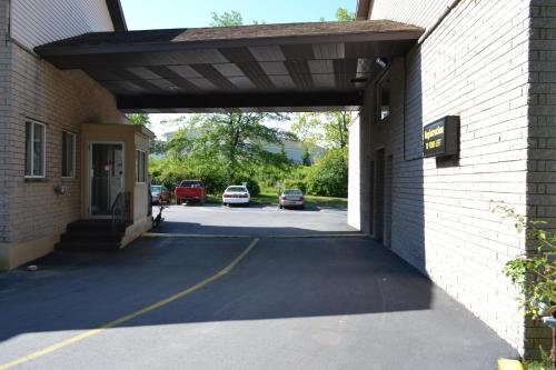 a parking garage with a car parked in a parking lot at Latham Inn in Latham