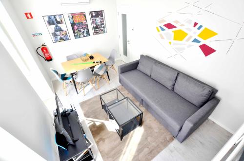 a living room with a couch and a table at The Red Jedi in Lisbon