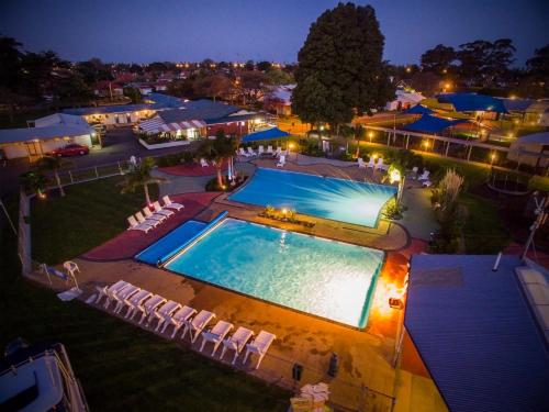 an overhead view of a swimming pool at night at Kennedy Park Resort Napier in Napier