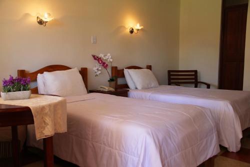 Säng eller sängar i ett rum på Hotel Villa de Valverde