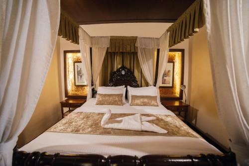 Ένα ή περισσότερα κρεβάτια σε δωμάτιο στο Casa Menezes - A Heritage Goan Homestay
