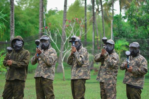 a group of soldiers standing in a field holding microphones at The Jayakarta Yogyakarta Hotel & Spa in Yogyakarta