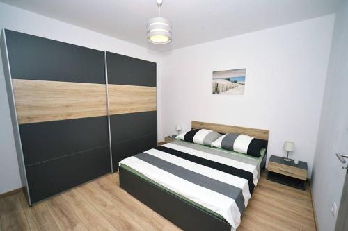 מיטה או מיטות בחדר ב-Jovich Apartments 2