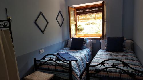 A bed or beds in a room at Magic Pirineos