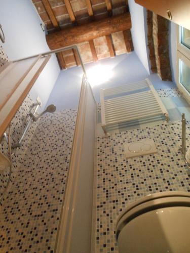 a bathroom with a toilet in a room at B&B La Corte in Capannori