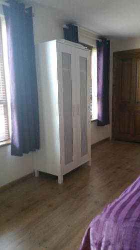 Postel nebo postele na pokoji v ubytování Maghernahar House B&B