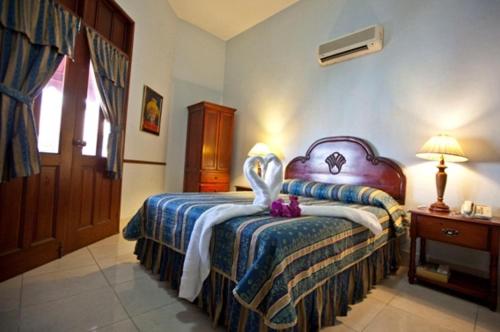 Postel nebo postele na pokoji v ubytování Hotel Discovery