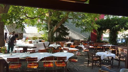 a group of tables and chairs in a restaurant at Landhotel Zur alten Post in Lohr am Main