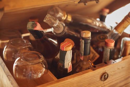 a wooden box filled with bottles of wine at Hotel Alle Ciaspole in Fondo