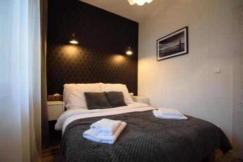 Ένα ή περισσότερα κρεβάτια σε δωμάτιο στο MNE Apartament