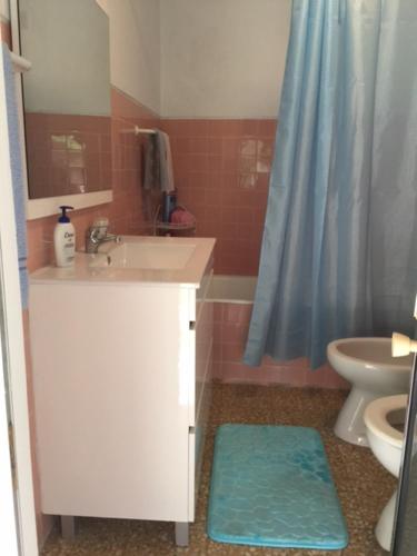 a bathroom with a sink and a toilet and a shower at Casa da Avó in Geres