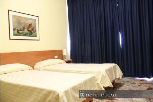 Una cama o camas en una habitación de Hotel Ducale