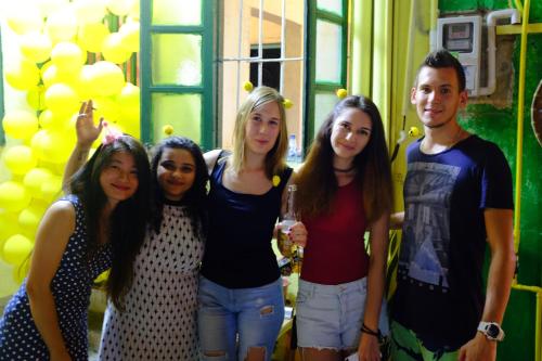 a group of people posing for a picture at a party at Yellow House Hostel Huizhou West Lake in Huizhou