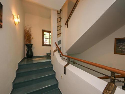 a staircase in a house with blue stairs at Landgasthof Neuwirt in Lofer