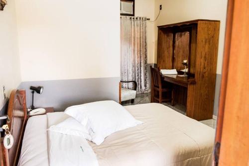 Katil atau katil-katil dalam bilik di Pousada Cantina Italiana
