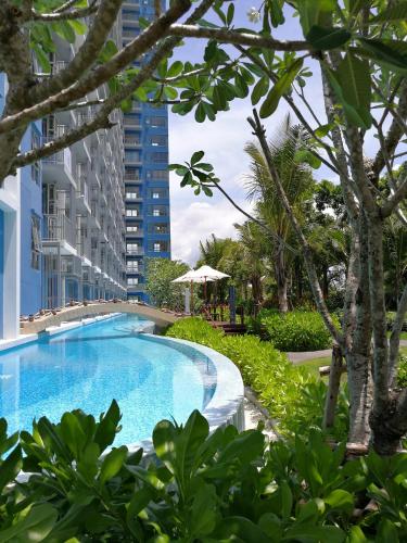 a swimming pool in the middle of a building at BLU-Pool Access in Cha Am